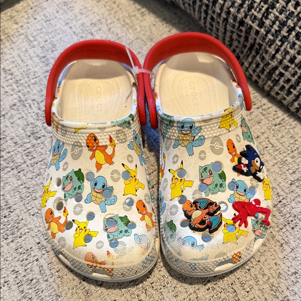 Preloved kids Pokémon crocs with the 3 charms